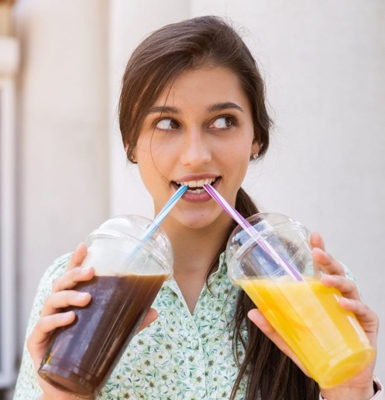 Young woman with sugary drinks.